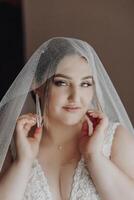A woman is wearing a veil and is posing for a picture photo