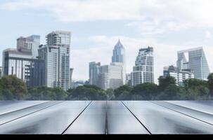 Template empty top black wooden table with cityscape view background photo