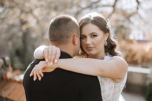 A man and a woman are hugging each other photo