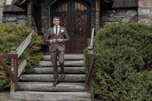 A man in a suit is walking up a set of stairs photo