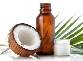 Coconut Oil and Halved Coconuts on Palm Leaf photo