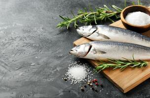 Raw Sea Bass on Cutting Board photo