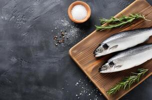 Raw Sea Bass on Cutting Board photo