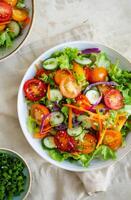 Fresh Salad With Tomatoes, Cucumbers, and Jalapenos photo