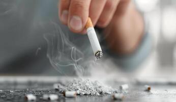 Hand Lighting a Cigarette With Ash photo