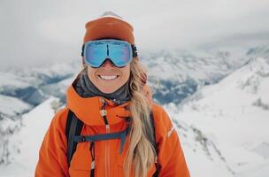 Woman Smiles in Ski Goggles on Mountaintop photo