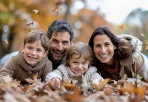 Happy Family In Autumn Leaves photo