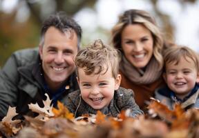 Happy Family In Autumn Leaves photo
