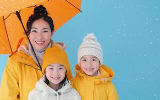 Family Under Umbrella in Snow photo