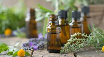 Essential Oils and Herbs on Wooden Surface photo
