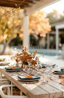 Outdoor Table Setting With Fall Foliage photo