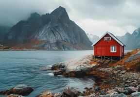 Red Cabin on Rocky Shore in Norway photo