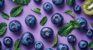 Blueberries and Mint on Purple Background photo