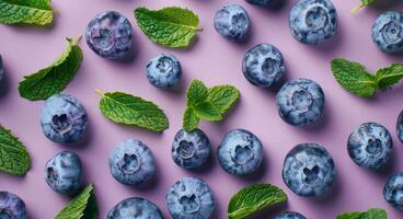 Blueberries and Mint on Purple Background photo