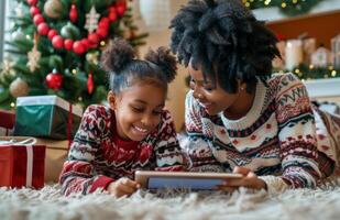 Mother and Daughter Using Tablet During Christmas photo