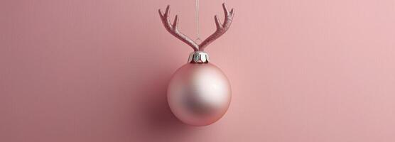 Pink Glitter Ornament With Antlers on Pink Background photo