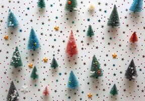 Miniature Christmas Trees Decorated With Colorful Stars and Snow photo