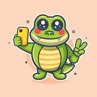 funny crocodile animal character mascot taking a selfie with a smartphone isolated cartoon vector