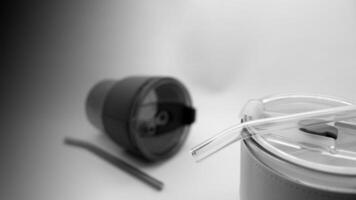 Tumbler in the form of a glass or glass mug with a modern design photo