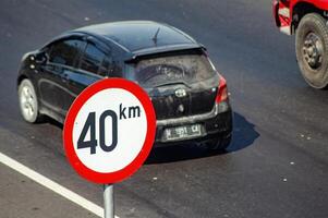 Speed limit and minimum speed signs on Indonesian Toll roads. The maximum speed limit is 40 KM per hour, Indonesia, 16 July 2024. photo