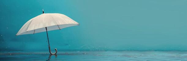 White Umbrella Standing In Rain Over Blue Water photo