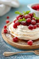 Meringue Dessert With Red Currants photo