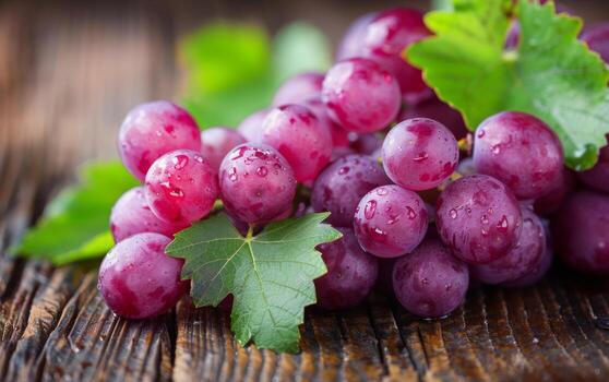 Red Grapes With Dew on Wooden Surface photo