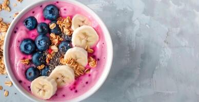 Pink Smoothie Bowl With Banana and Blueberries photo