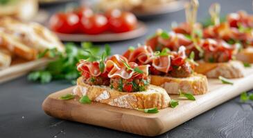 Sausage and Tomato Bites on a Wooden Cutting Board photo
