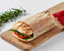 Wrapped Sandwich on Cutting Board photo