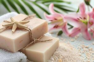 Wrapped Soap Bars on White Towel With Lily photo