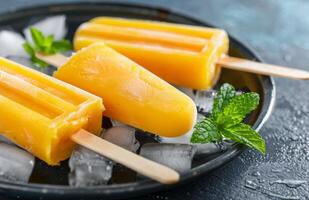 Passionfruit Ice Pops With Mint Garnish photo
