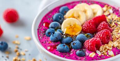 Pink Smoothie Bowl With Berries and Banana photo