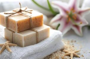Wrapped Soap Bars on White Towel With Lily photo