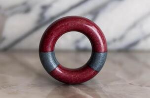 Red And Blue Wooden Ring On White Surface photo