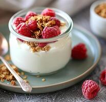 Yogurt With Granola and Raspberries photo