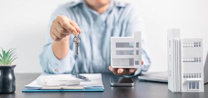 Real estate agent helped the client secure a mortgage loan for their property investment, ensuring the contract was properly handled by the broker. investment, property, estate, loan, real, mortgage. photo