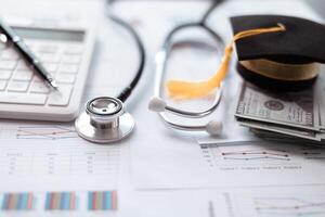 Earning degree in medicine requires significant saving and investment in education with careful financial planning crucial for aspiring doctors navigating banking and money management during studies. photo