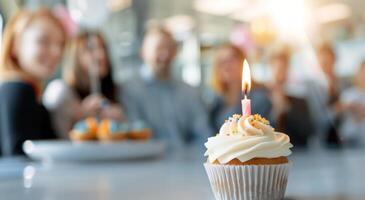 Birthday Cupcake With Colleagues in Background photo