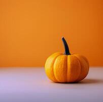 Single Pumpkin on White Table photo