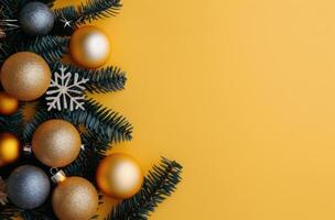 Gold And Silver Christmas Ornaments On Yellow Background photo