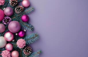 Christmas Ornaments and Pine Branches on Blue Background photo