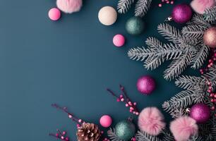 Christmas Ornaments and Pine Branches on Blue Background photo