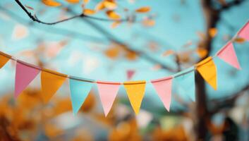Colorful Bunting Flags Hanging in Tree photo