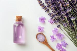 Lavender Essential Oil and Flowers on White Background photo