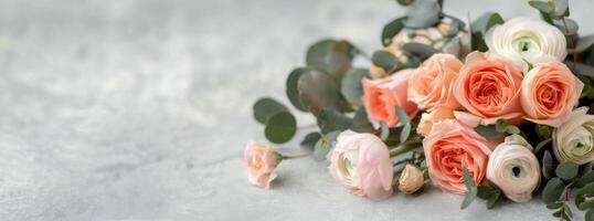 Peach and White Ranunculus Bouquet on Gray Background photo