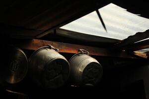 a row of pots with a cross on the front photo
