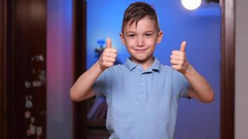 elementary school student boy smiles and shows a gesture of class, like, success video