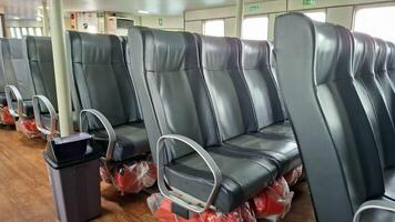 Rows of empty seats on a ferry ready for passengers photo