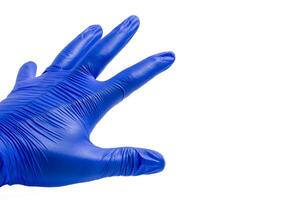 Hand in blue glove isolated on a white background. photo